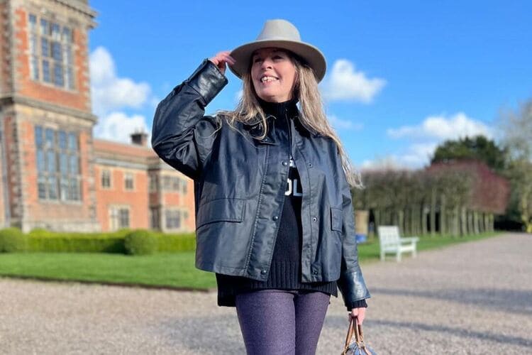 a woman wearing Fedora hat