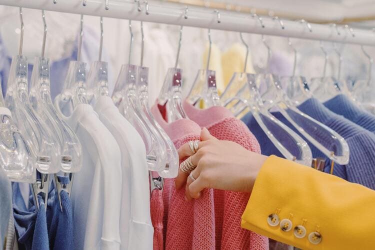 Assorted Clothes Hanging on a Rack