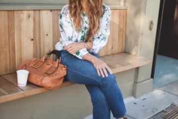 fashion blogger sitting jeans