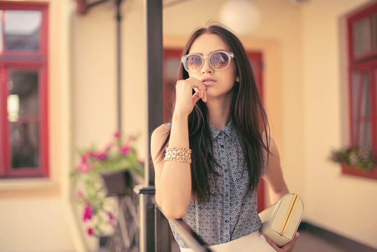 girl holding chin