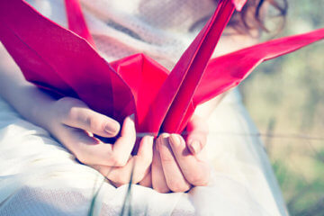 girl holding paper craft