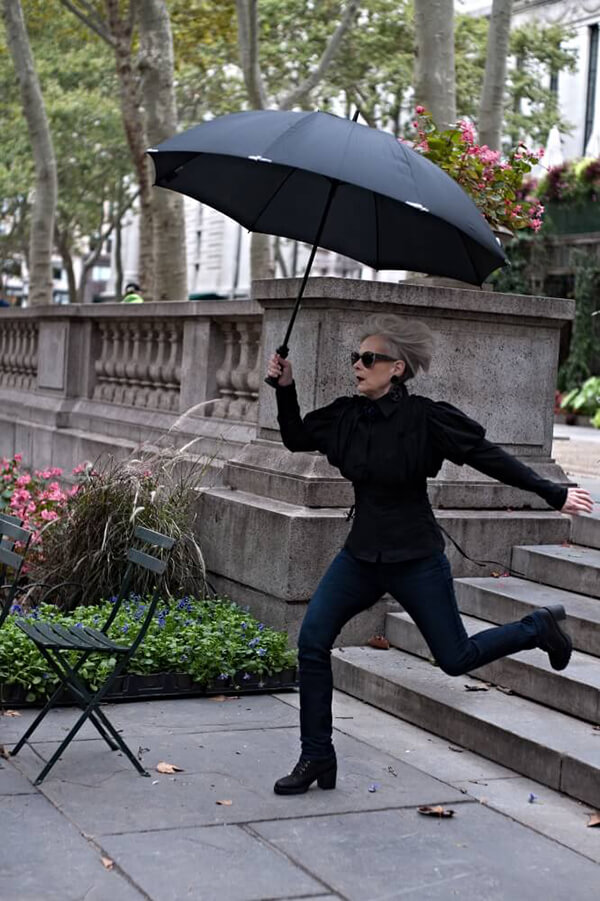 lyn slater holding umbrella