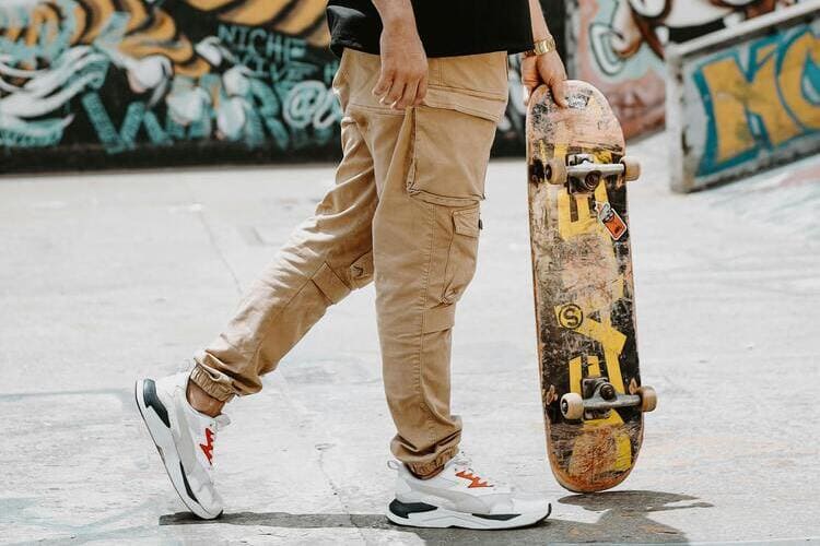 Man with a Skateboard in a Skatepark