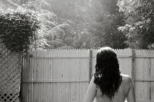 naked back self portrait in yard