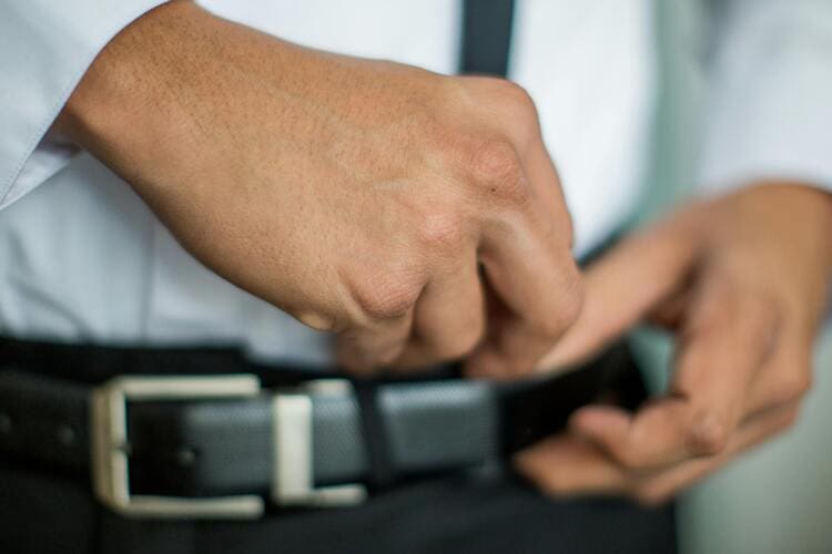 Person Wearing Black Leather Belt