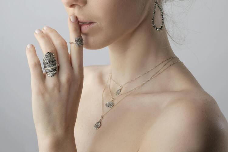 Portrait Photo of Woman With Rings, Earring and Necklace