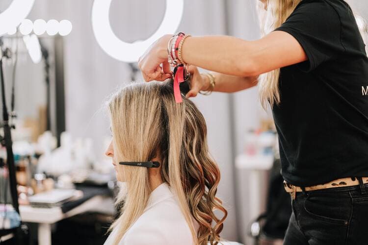 Woman Doing Her Hair on a Backstage