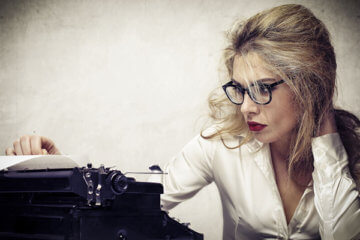 woman operating typewriter