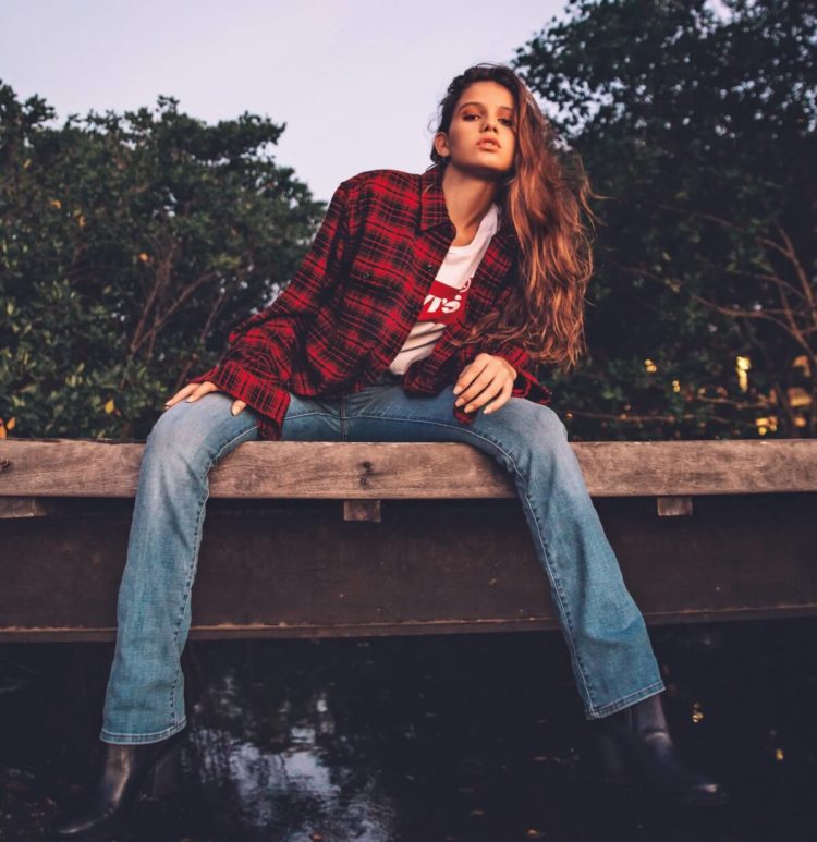 Woman Wearing Jeans and Plaid Shirt